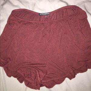 Maroon, stretchy shorts.