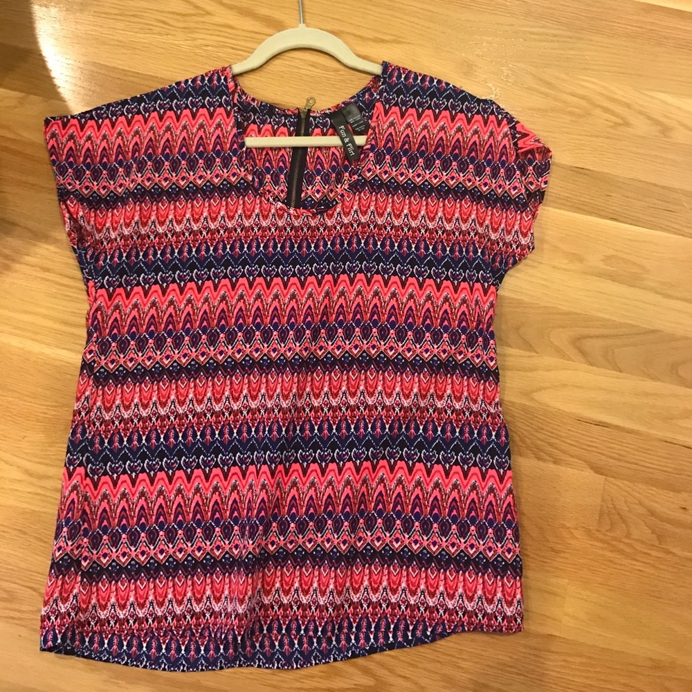 Bright colored patterned blouse