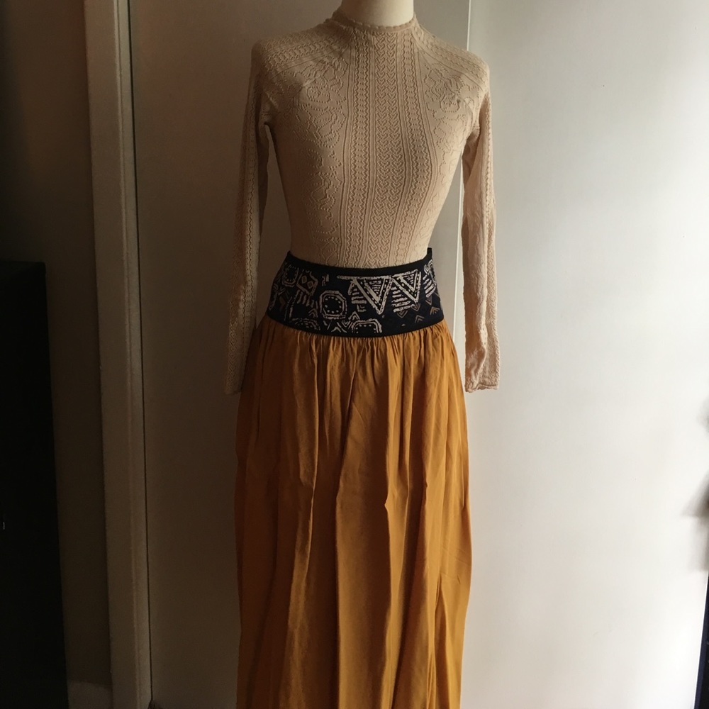 Unique midi skirt. Decorated waist
