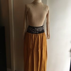 Unique midi skirt. Decorated waist