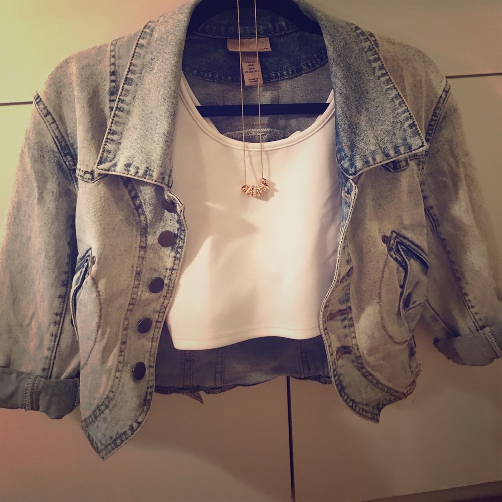 Washed out cropped jean jacket with cool details!