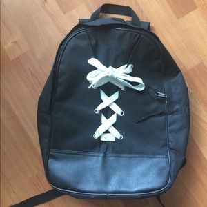 Black shoelace book bag backpack.