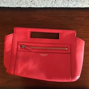 Coach clutch bar coral leather