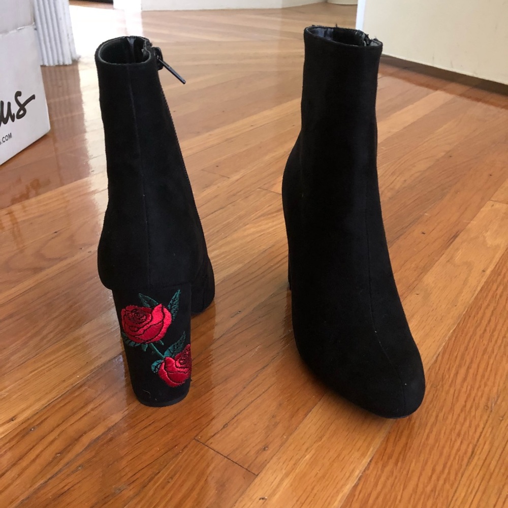 Black booties with rose details.