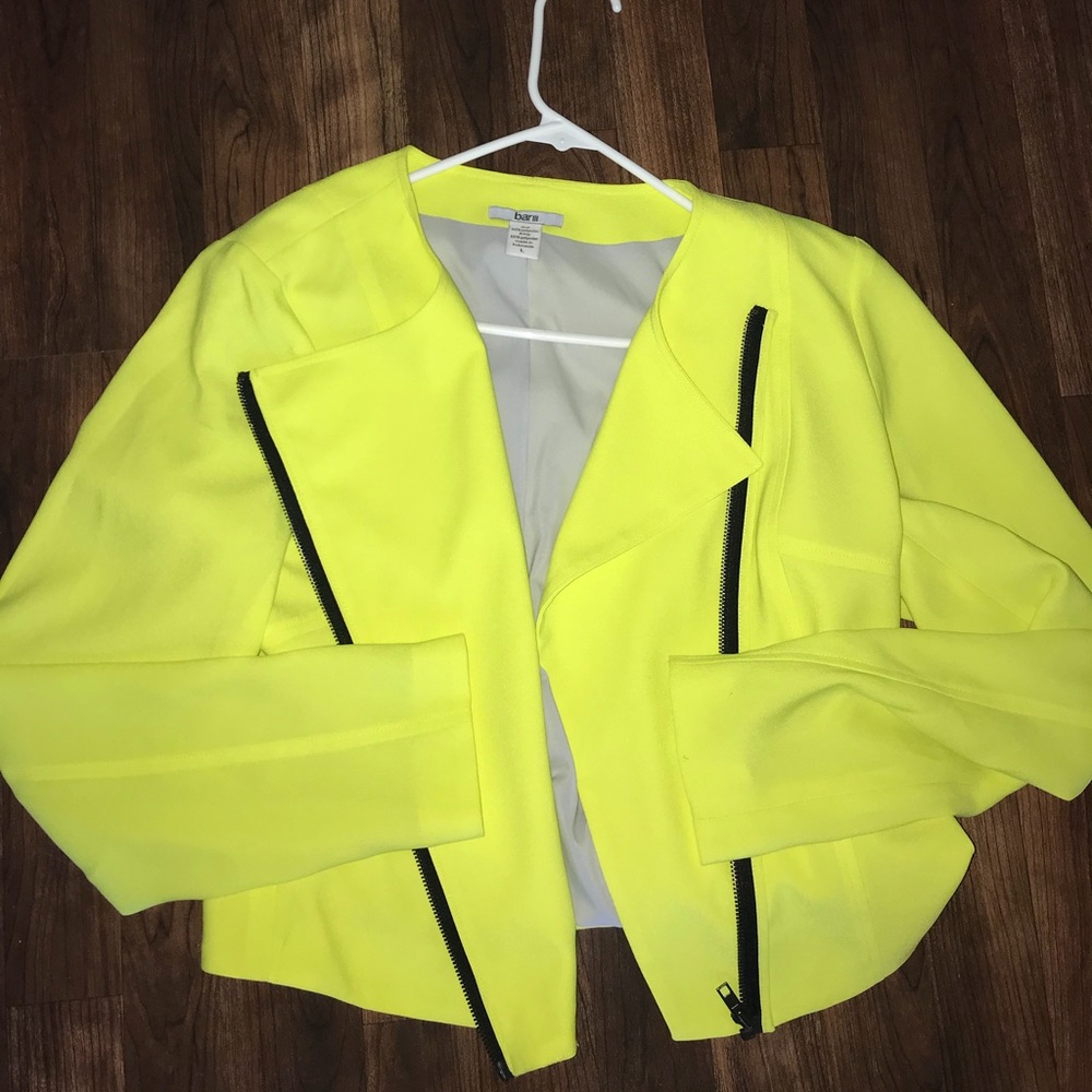 Bright yellow blazer with black zipper