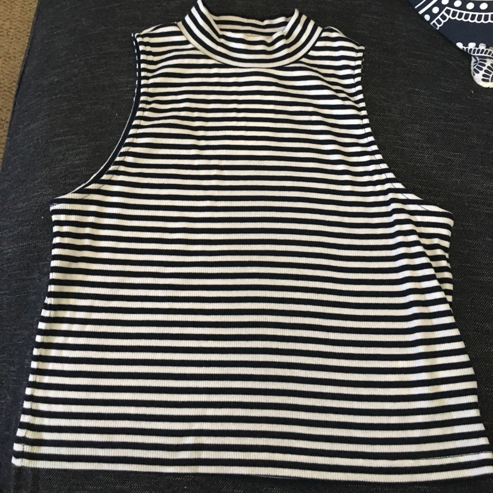 neck high shirt with 2 small stains on back barely