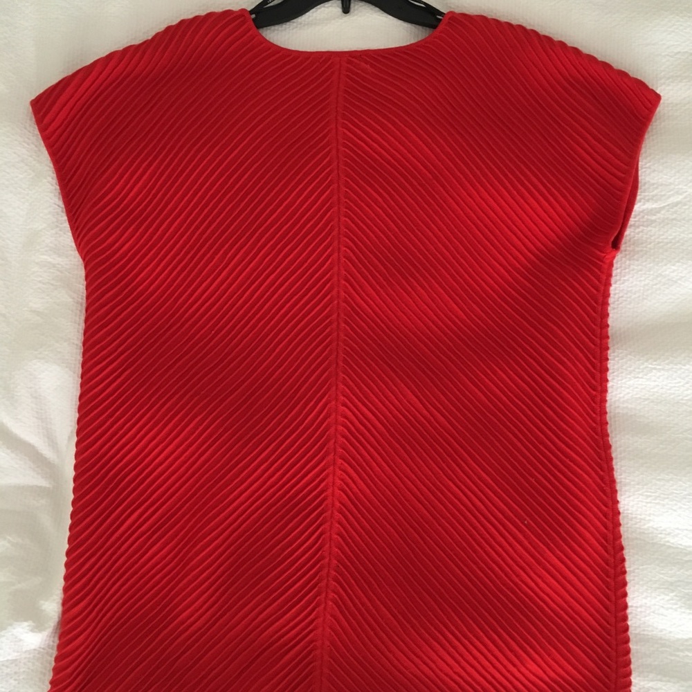 Red tunic by Josie Natori.