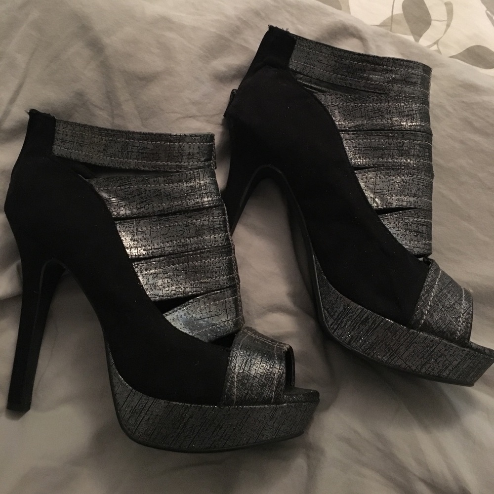 Platform peep toe/strappy ankle booties.