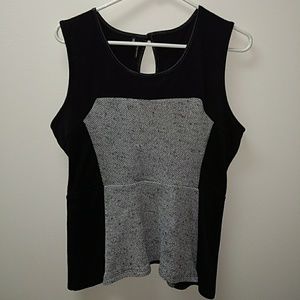A black and white peplum tank