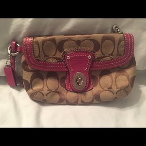 Coach wristlet with pink strap
