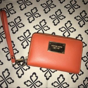 Michael Kors orange wristlet wallet