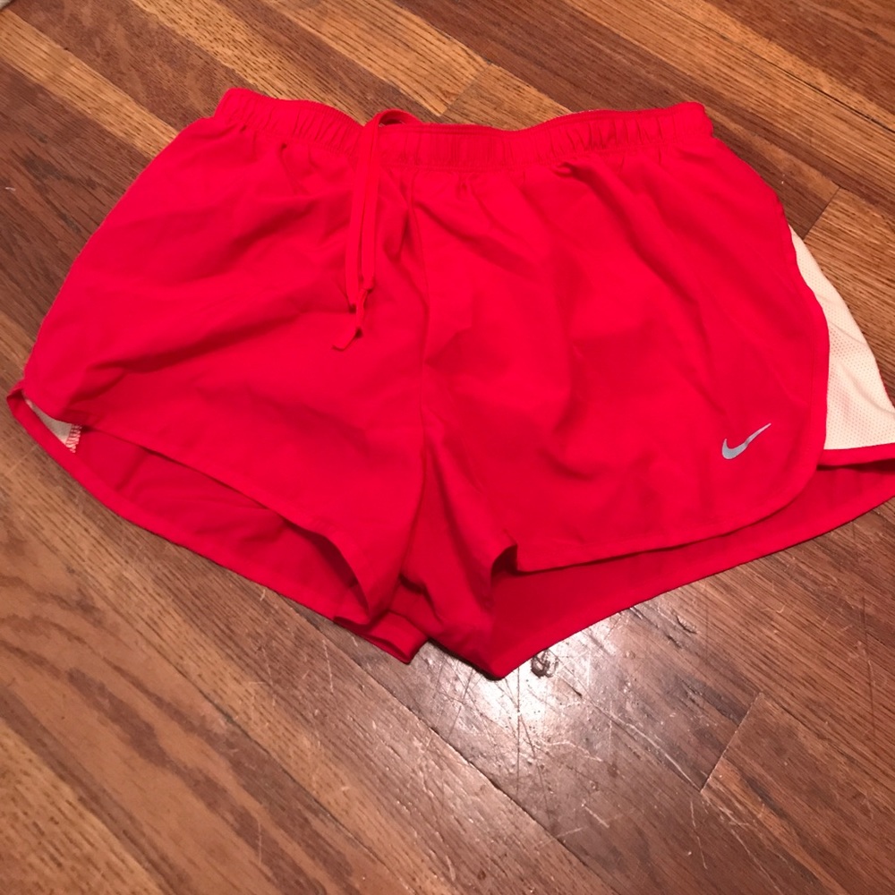 Red Nike running shorts