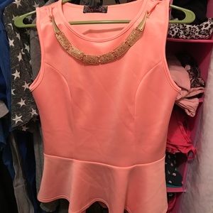 Peplum top with necklace