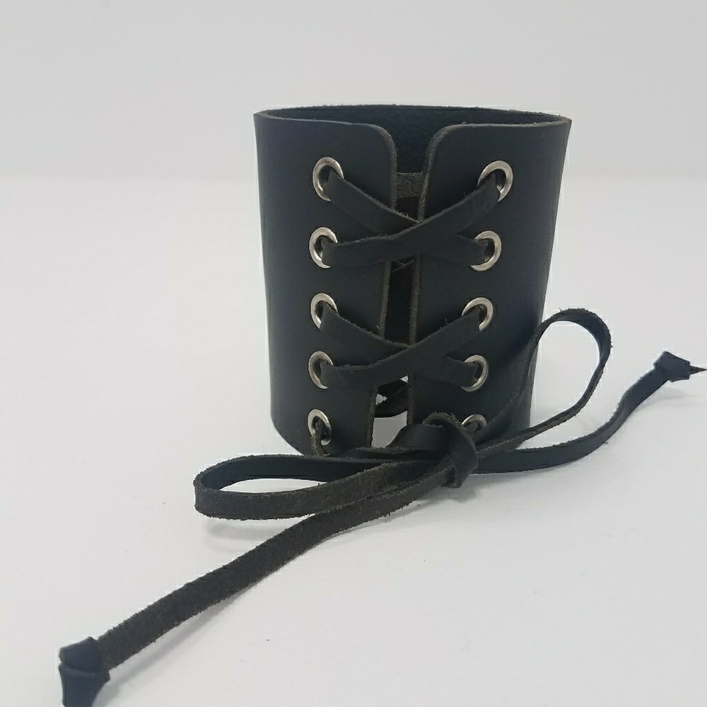 Real leather lace up cuff.