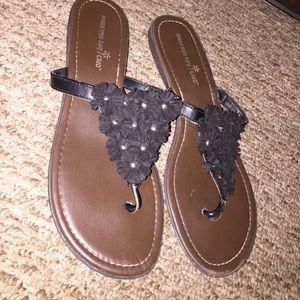 Black flower flip flops
