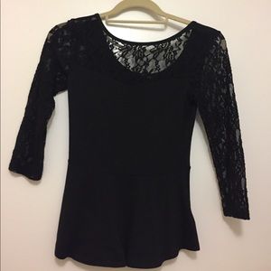 Peplum hem shirt with lace sleeves and details