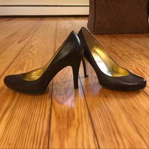 Slight platform, brown leather high heel shoes.