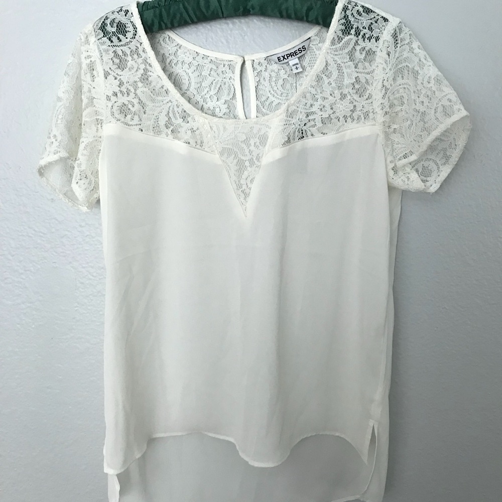 Cream colored blouse with lace details