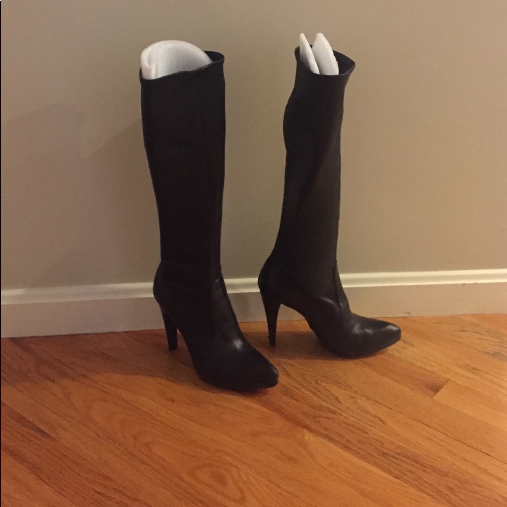Black high heeled boots.