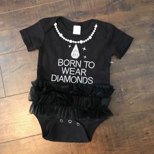 Never worn, cute black onesie with tutu