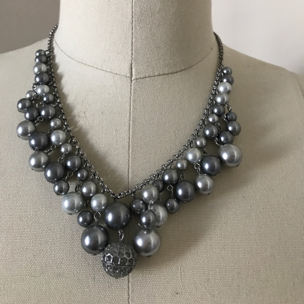 Classic pearls. Gray and white with rhinestones.