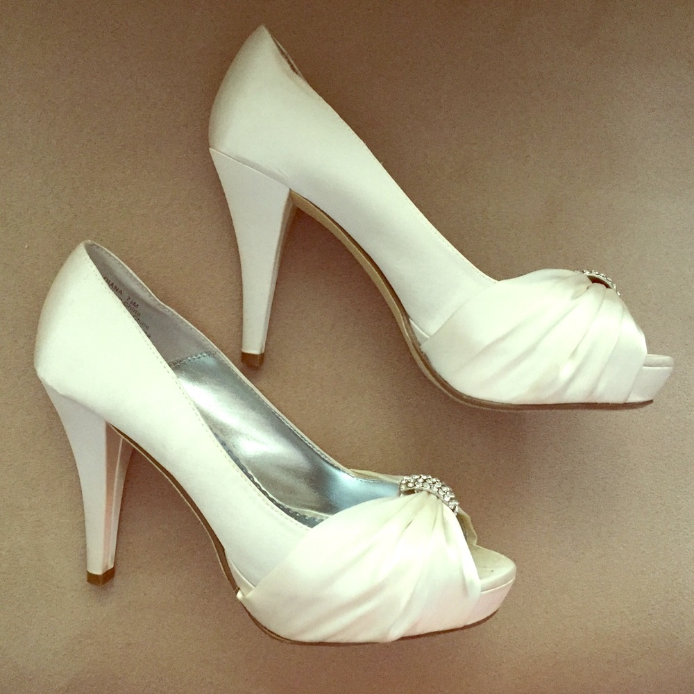 Off white Satin pumps.