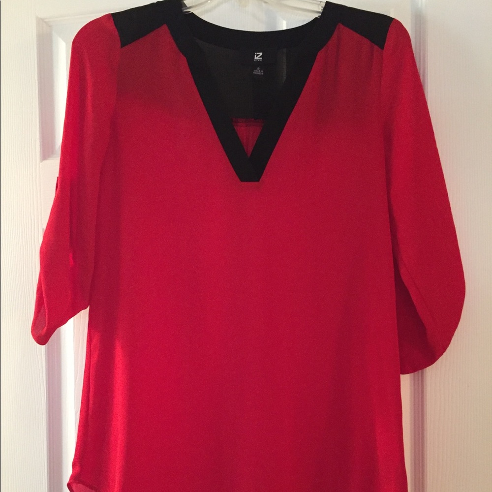 Red 3-quarter sleeve blouse with black neckline