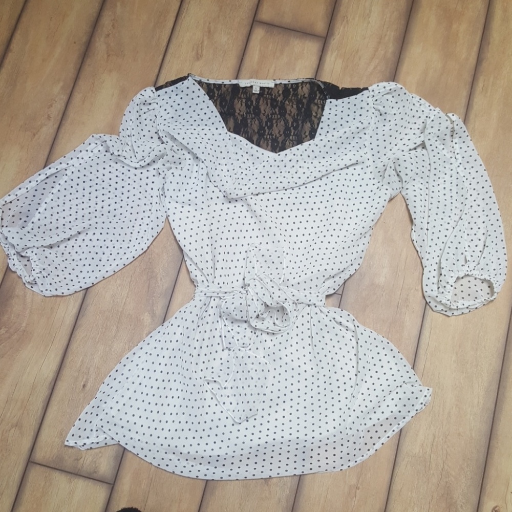 Cream top with black polka dots