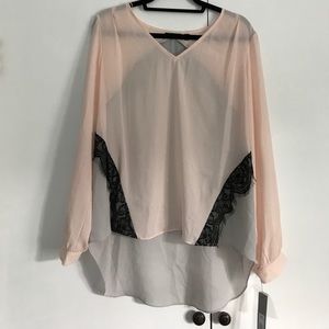 This is a gray and pink blouse