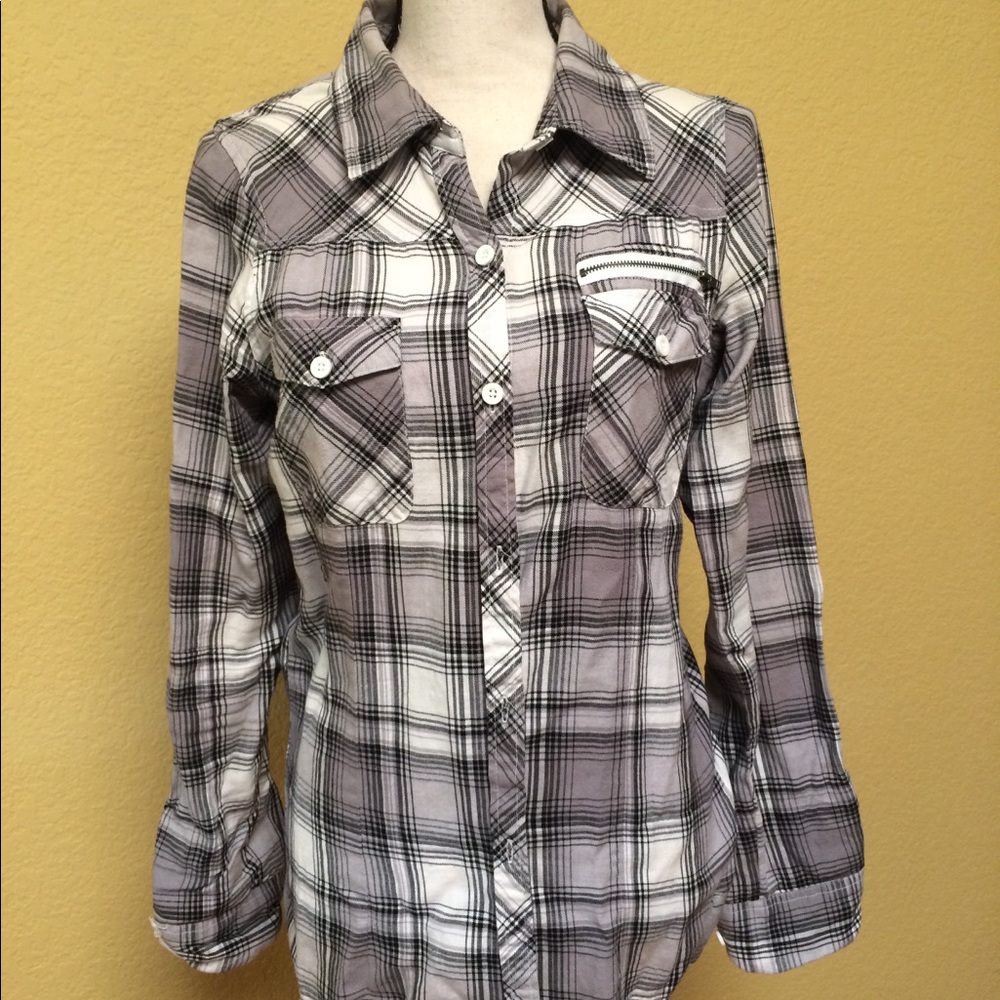 Long sleeve black white and grey checkered shirt.