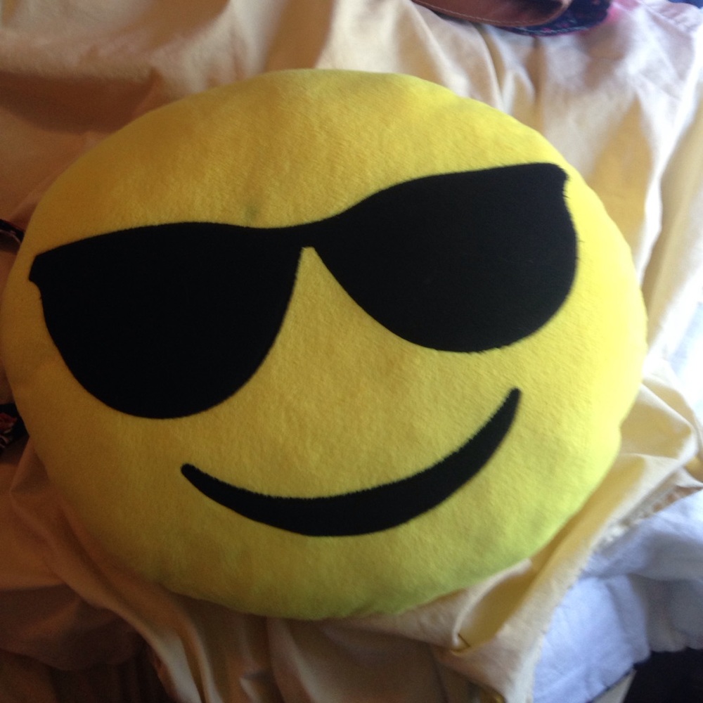 An emoji pillow