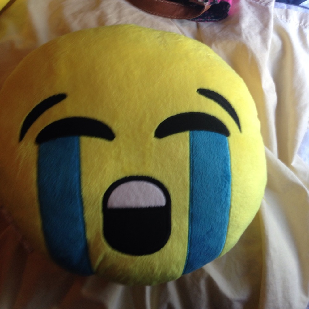 An emoji pillow