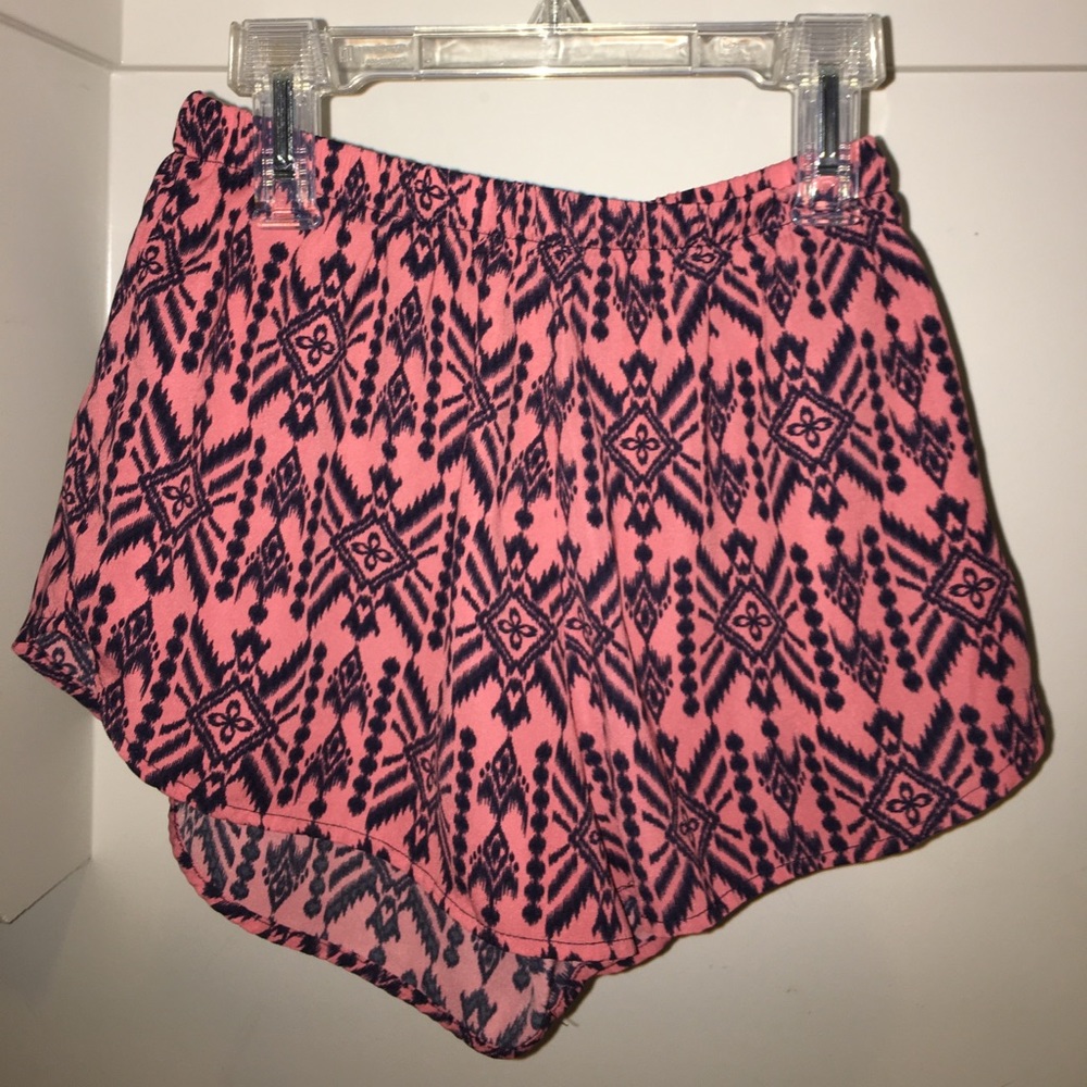 Orange/pink short shorts.