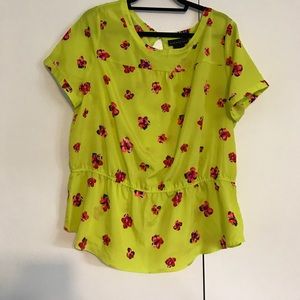 A multi-colored floral shirt-sleeved blouse