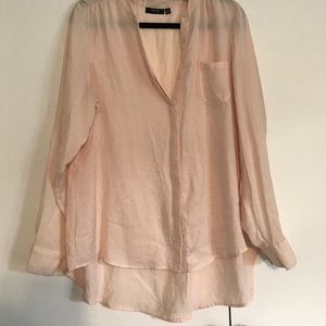 A pastel pink high-low blouse