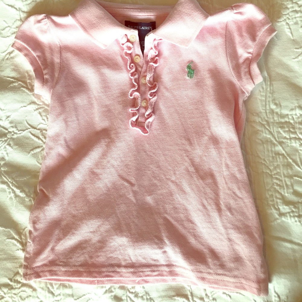 Perfect pink top with slight ruffles at buttons