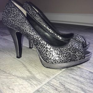 Silver leopard patterned platform heels.