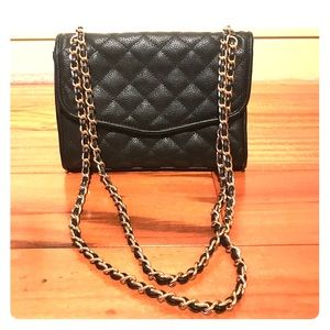 Forever 21 black quilted handbag with gold chain.