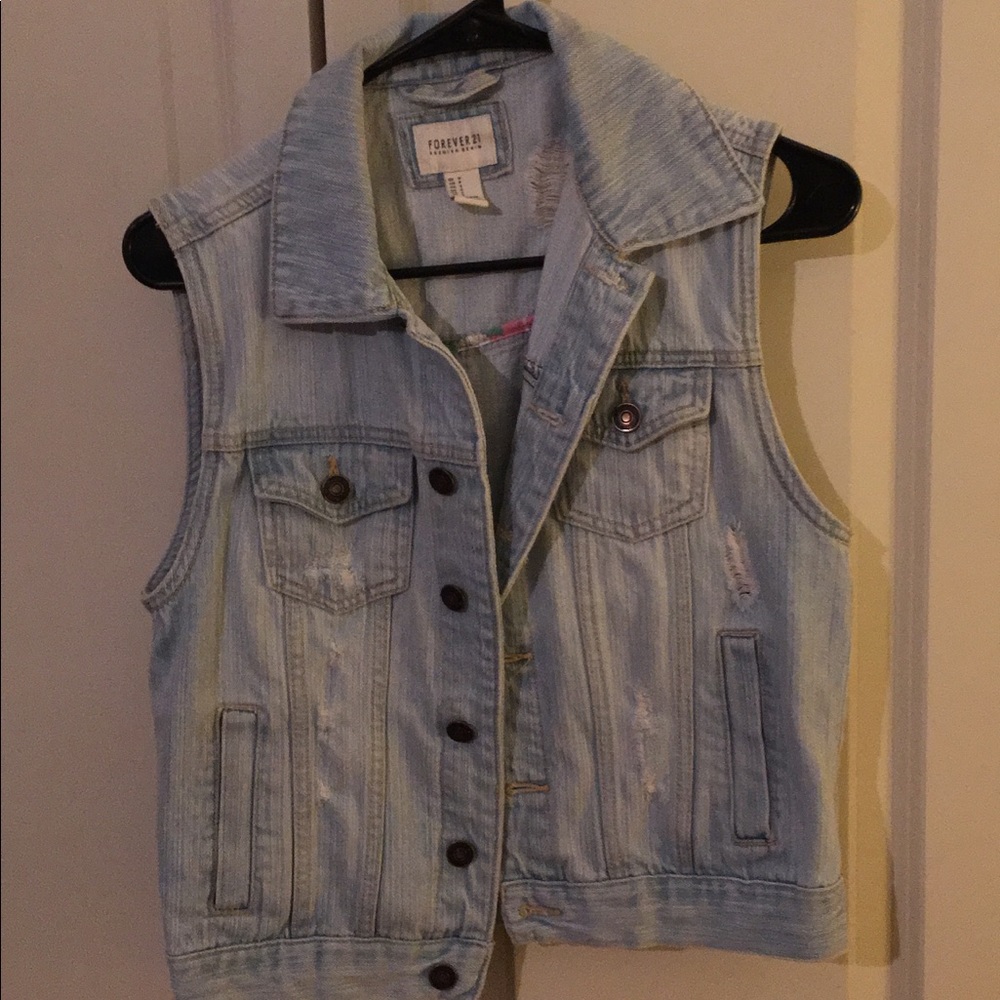 Light denim distressed vest
