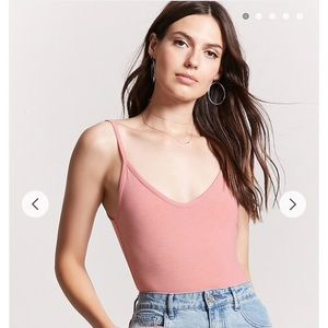 Pink ribbed bodysuit with open back