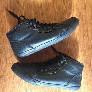 Black leather Le Coq Sportif high top sneakers