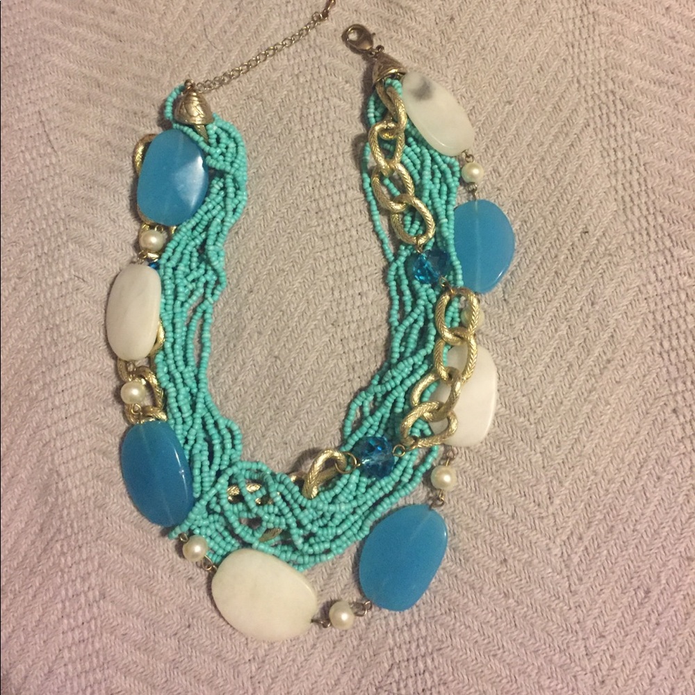 Multi stranded turquoise,gold,white necklace