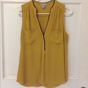 Black trim sleeveless blouse