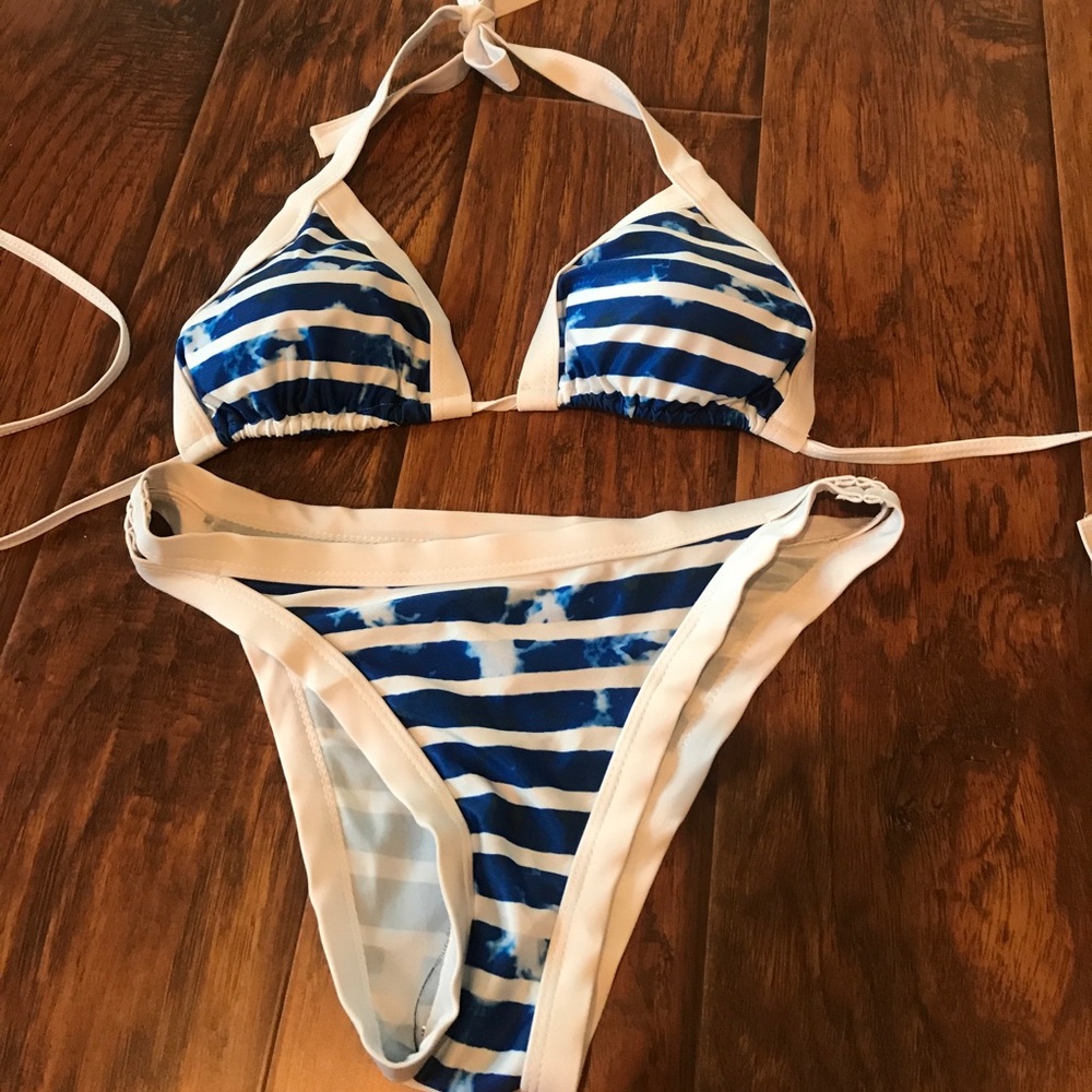 Swimsuit never worn.  Medium top medium bottom