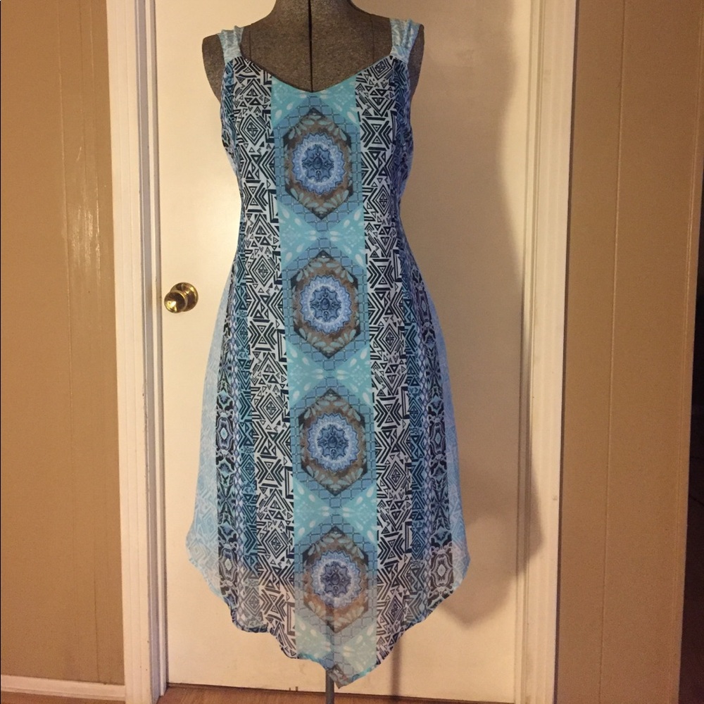 Teal, blue, and white sleeveless dress