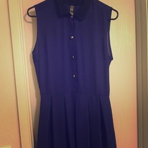 Blue sleeveless dress with black collar, buttons