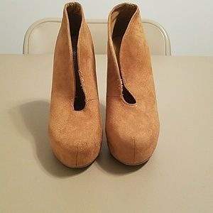 pair of open heel boots size 7