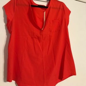 A coral blouse with v-neck