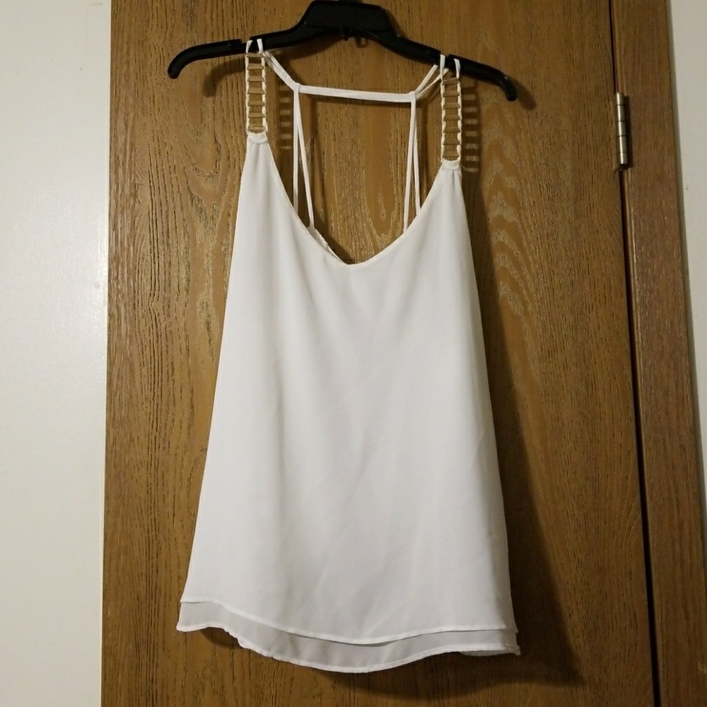 Elegant white shirt with gold detail up the straps