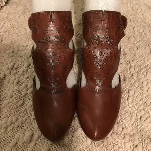 Beautiful laser cut leather sandals.